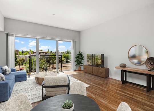 A living room with a view of a fence and a blue sky.