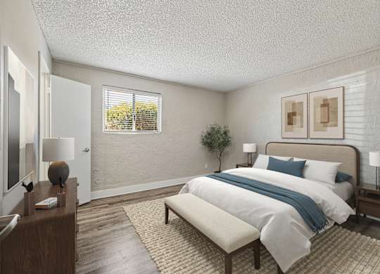 A bedroom with a bed, nightstand, and window.