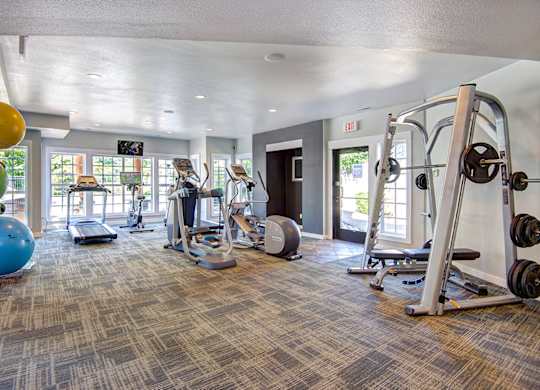 Fitness center at Deer Creek Apartments, Puyallup, WA, 98373