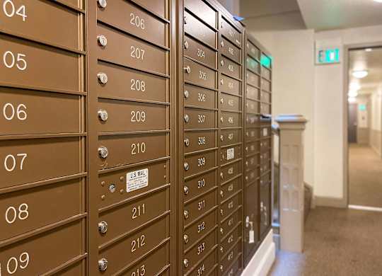 A series of brown mailboxes numbered from 04 to 09 and 206 to 213. at Zindorf, Seattle, WA