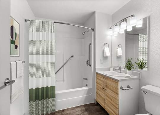 A white bathroom with a wooden vanity and a white bathtub.