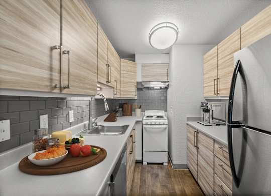 A modern kitchen with wooden cabinets and stainless steel appliances.
