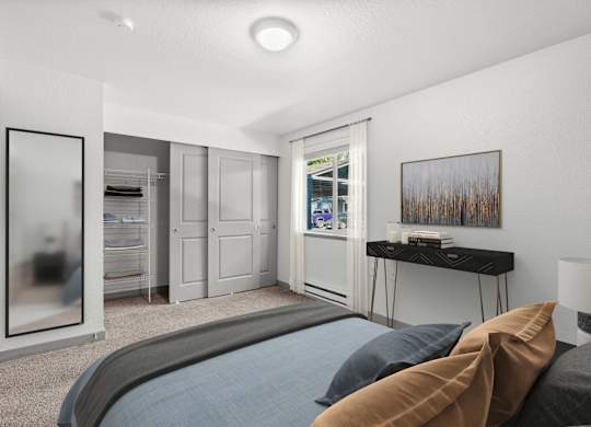A bedroom with a large bed and a painting on the wall.