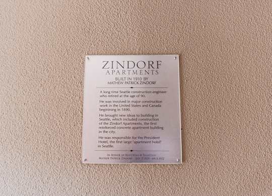 A plaque on a wall that says Zindorf Apartments. at Zindorf, Seattle, WA, 98104