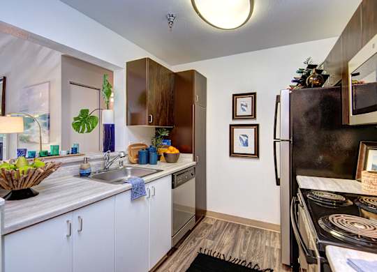 Kitchen with Black Appliances at Signature Pointe, Kent, Washington