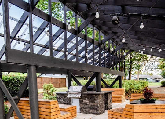A wooden structure with a glass roof and hanging lights. at The Retreat, Sumner, Washington