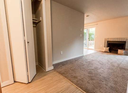 A room with a fireplace and a rug on the floor. at Notch 8, Washington, 98444