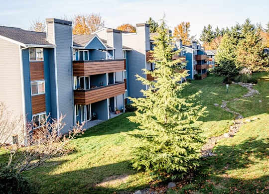 A view of apartment buildings with a green lawn in front. at Northpoint Apartments, Washington, 98407
