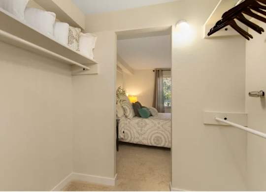 A small bedroom with a bed and a window. at The Retreat, Sumner, Washington