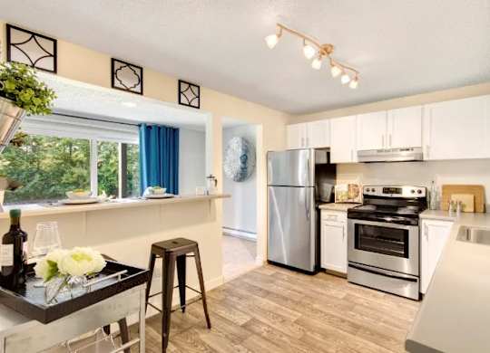 A kitchen with a stove, refrigerator, and oven. at The Retreat, Sumner