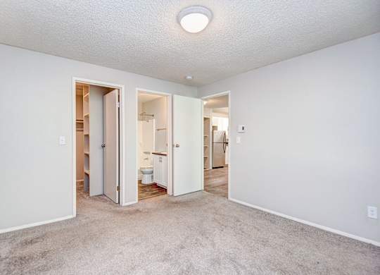 A white room with a carpeted floor and a ceiling light. at The Lakes at Fife, Fife, Washington