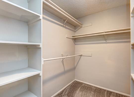 two pictures of a closet with white shelves and a hanger on the wall at The Lakes at Fife, Fife, WA, 98424
