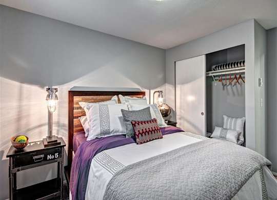 Bedroom with bed and lamp and ceiling light at Deer Creek Apartments, Washington, 98373