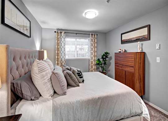 Puyallup Apartments- Deer Creek Apartments- bedroom with cozy bed at Deer Creek Apartments, Washington