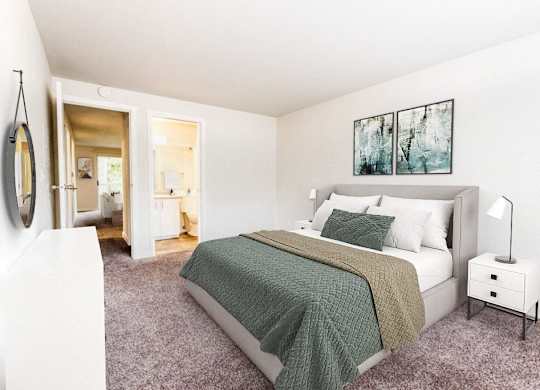 A bedroom with a bed, nightstand, and a painting on the wall.