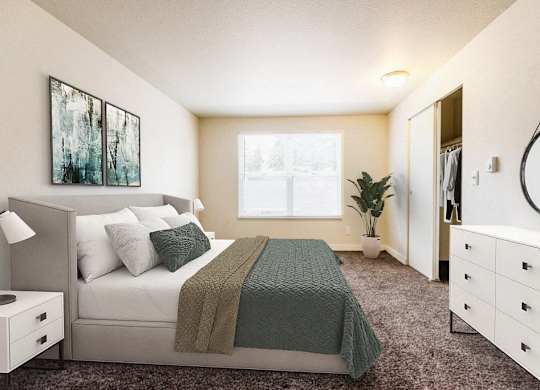 A bedroom with a bed, nightstand, and a plant.