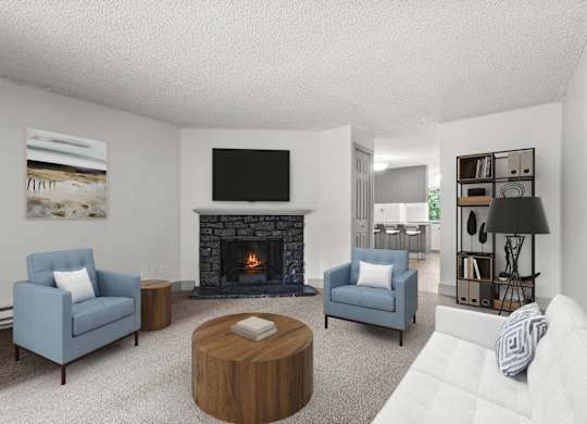 A living room with a fireplace, two chairs, a coffee table, and a book on the table.