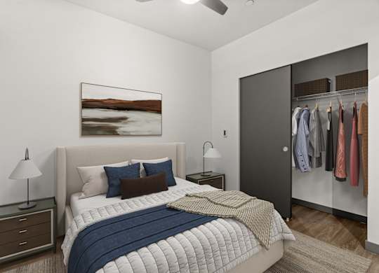 A bedroom with a bed, a nightstand, a ceiling fan, and a wardrobe.