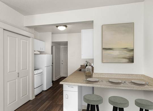 A kitchen with a table set for two with a painting hanging on the wall.