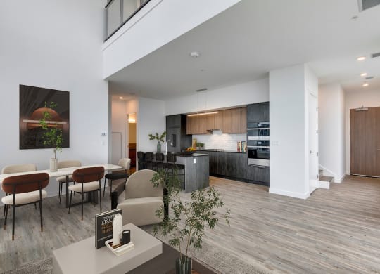 a living room with a kitchen and a dining room at BLVD Beltline, Calgary, AB