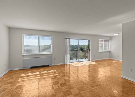 A room with wooden flooring and a sliding glass door at Kensington House, Maryland 20895