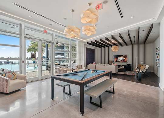Our two-story lakefront clubhouse features TVs, billiards and an entertainment kitchen