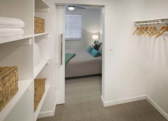 Large walk-in closets also feature built-in shelving