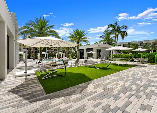 The District Boynton - Apartments near West Palm Beach - sundeck with hammocks