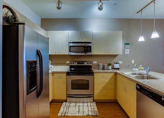 Apartments near OHSU - The Matisse kitchens with bamboo finish and granite countertops