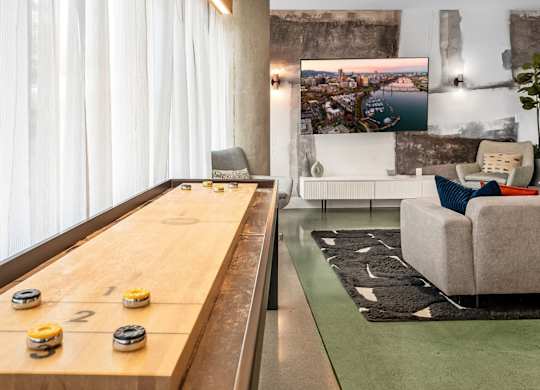A shiny billiard table with four balls on it.