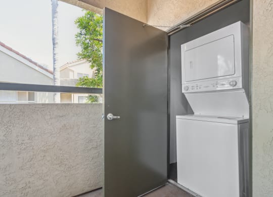 a washing machine and dryer on the side of a door