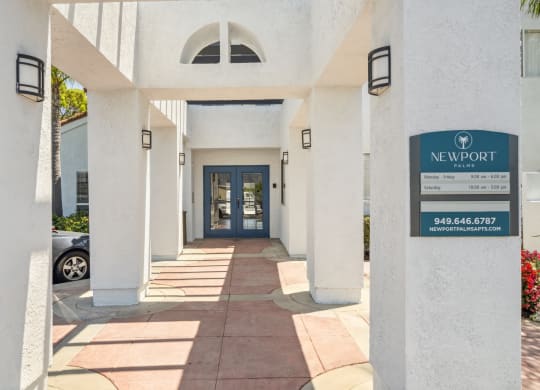 a building with a blue door and a sign that says