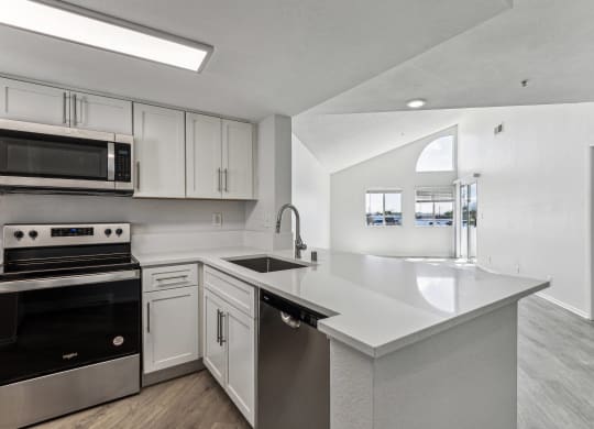 the preserve at ballantyne commons apartment kitchen with stainless steel appliances