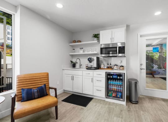a kitchen with a refrigerator and a microwave