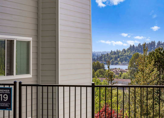 a balcony with a view of a city and a river