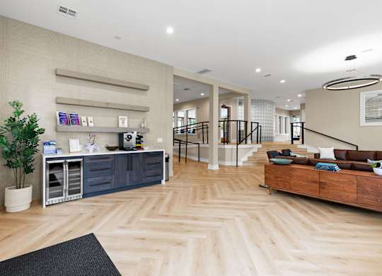 A well-lit, spacious interior with wooden flooring and a variety of furniture and decor.