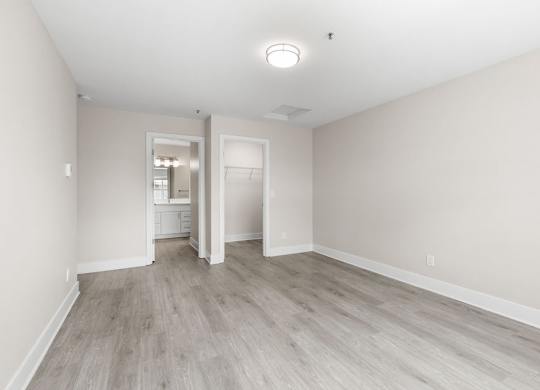 A room with a light grey floor and white walls.