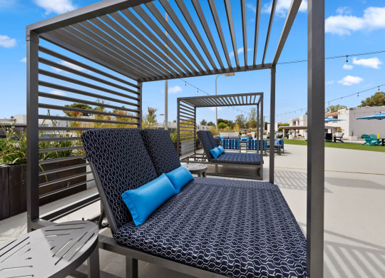 a patio with lounging daybeds