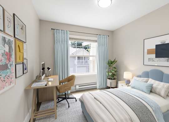 A bedroom with a bed, desk, chair, and window.
