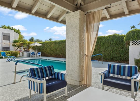 Del Sol Apartments Pool with Lounge Chairs