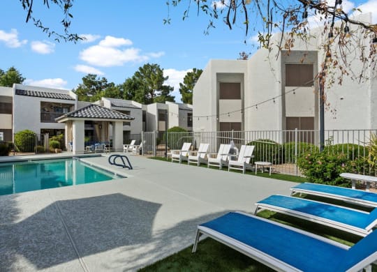 Del Sol Apartments Pool with Lounge Chairs