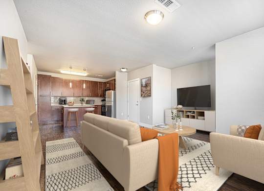 A living room with a couch and a television.