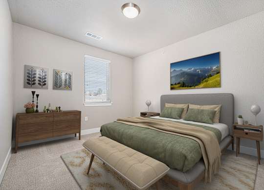 A bedroom with a large bed and a painting on the wall.