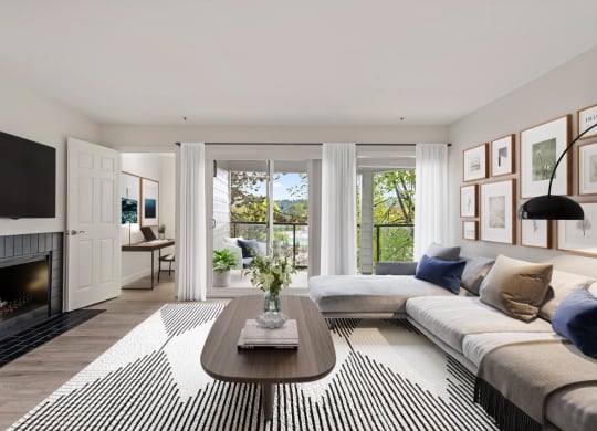 a living room with a couch and a coffee table and a fireplace
