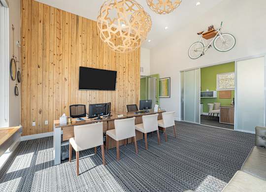 A room with a wooden wall and a television mounted on it.