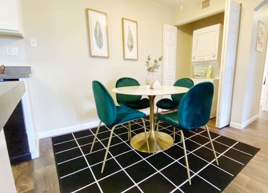 a dining room with a table and chairs
