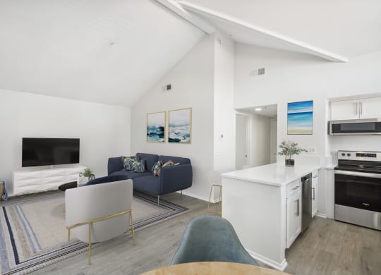 a view of the living room and kitchen from the dining area