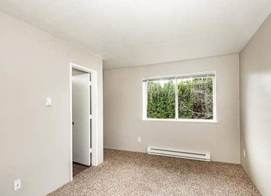A room with a window and a door.