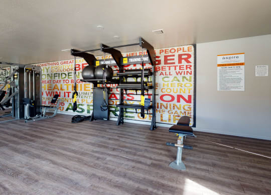 Fitness Center with All in One Training Station and Weight Machine at Aspire High Desert Apartments, Victorville, CA