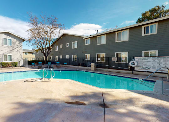 Aspire of the High Desert - Sparkling Pool Surrounded by Lounge Seating at Aspire High Desert Apartments, Victorville, CA